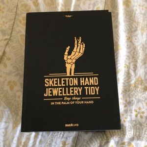 Jewelry holding skeleton hand